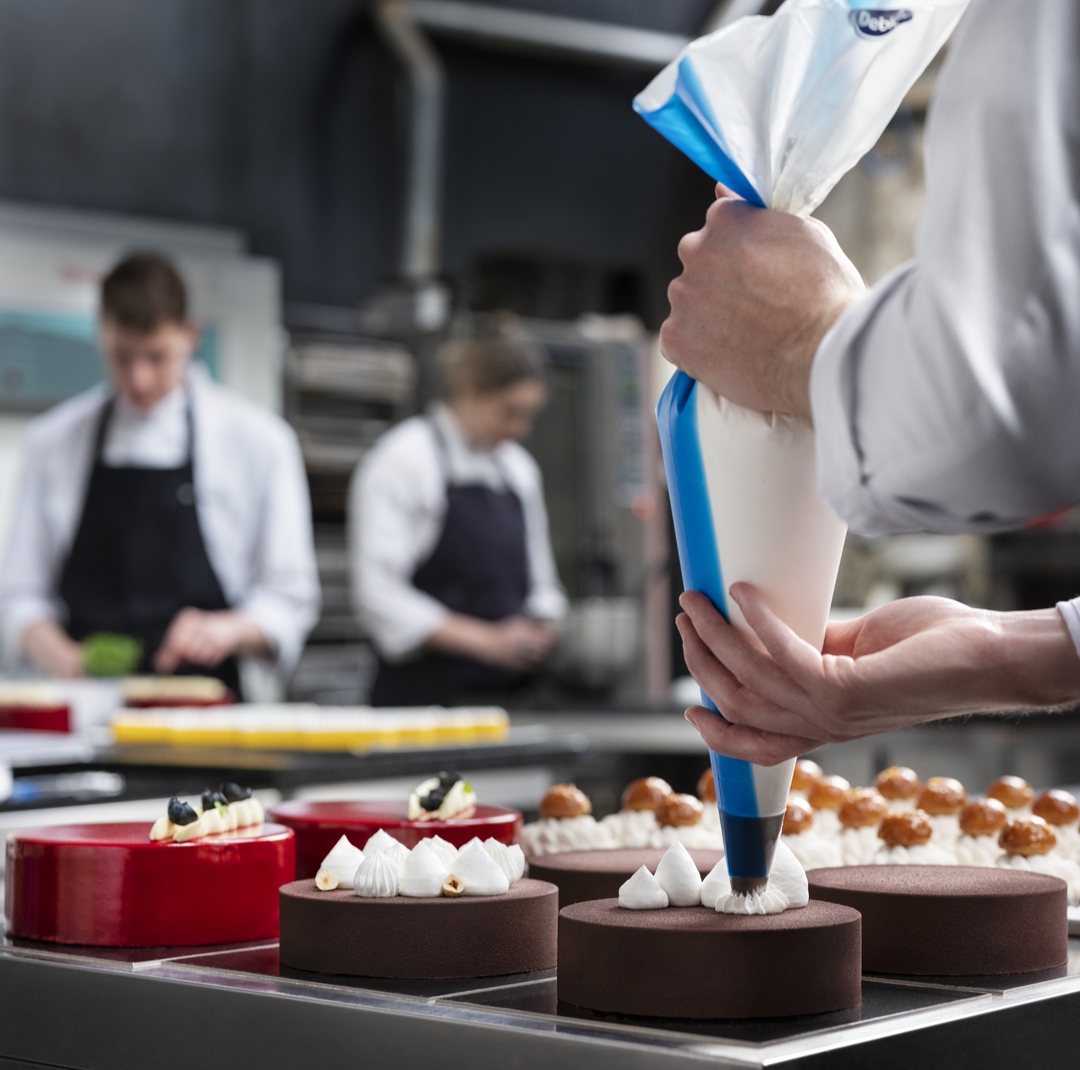 Bakers decorating pastry with Debic Blends products