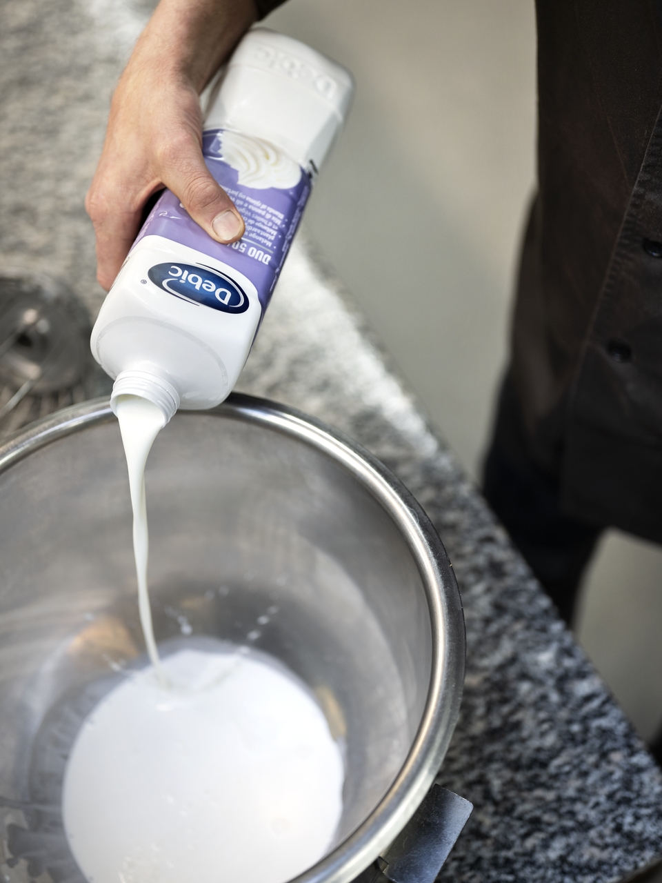 Debic natop being poured into a metal bowl