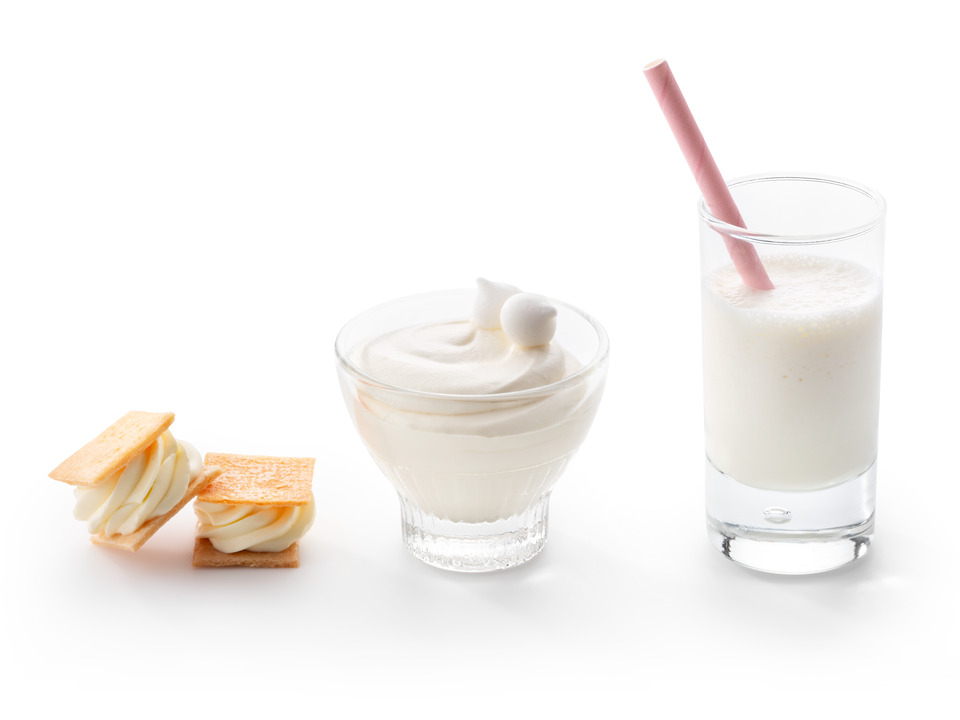 Three applications of Debic Parfait displayed on a white background: buttercream sandwiched between crisp biscuits, a light mousse served in a glass dessert cup, and a creamy milkshake in a glass with a pink straw.
