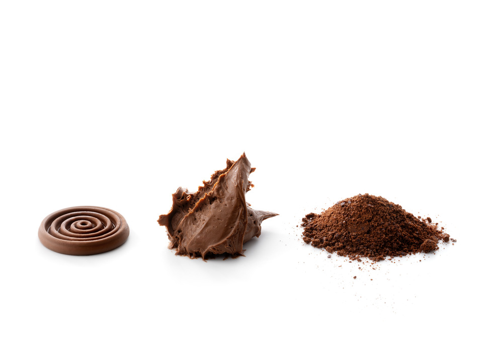 Three textures of Mousse Au Chocolat displayed on a white background: a smooth chocolate jelly spiral, a ganache montee dollop, and a pile of chocolate powder.