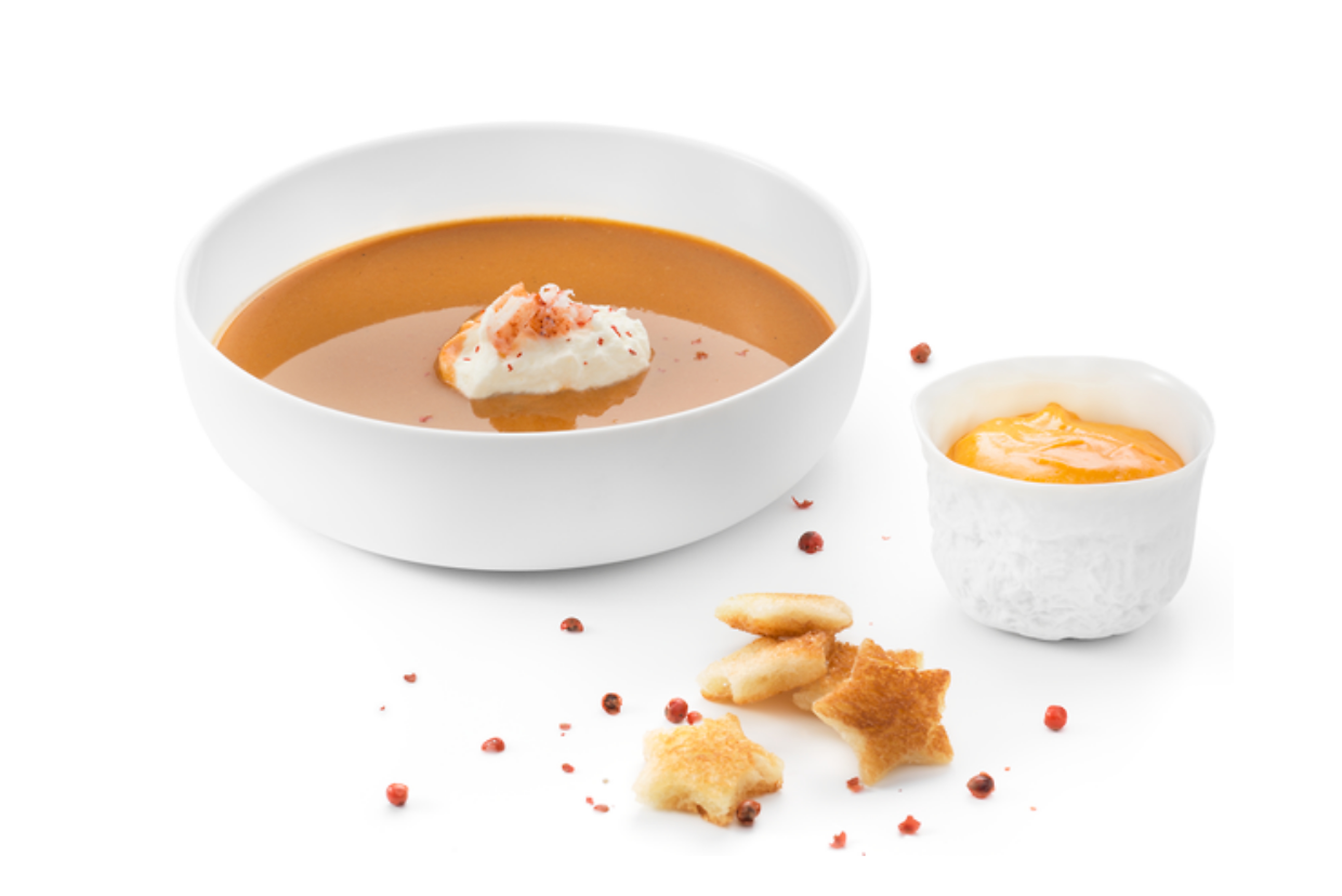 Lobster soup with whiskey sauce and star-shaped croutons on white background