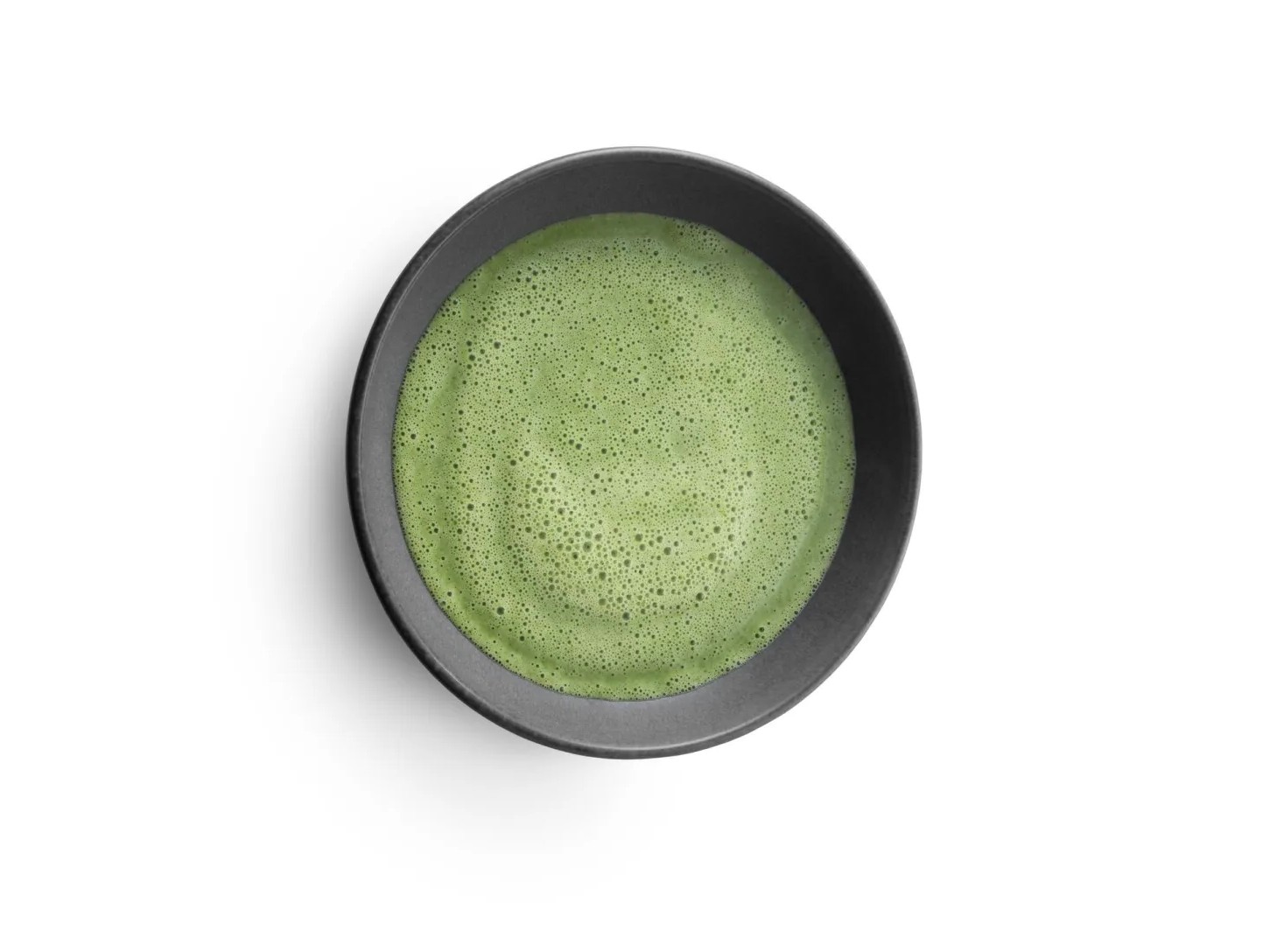 Spinach soup in a black bowl