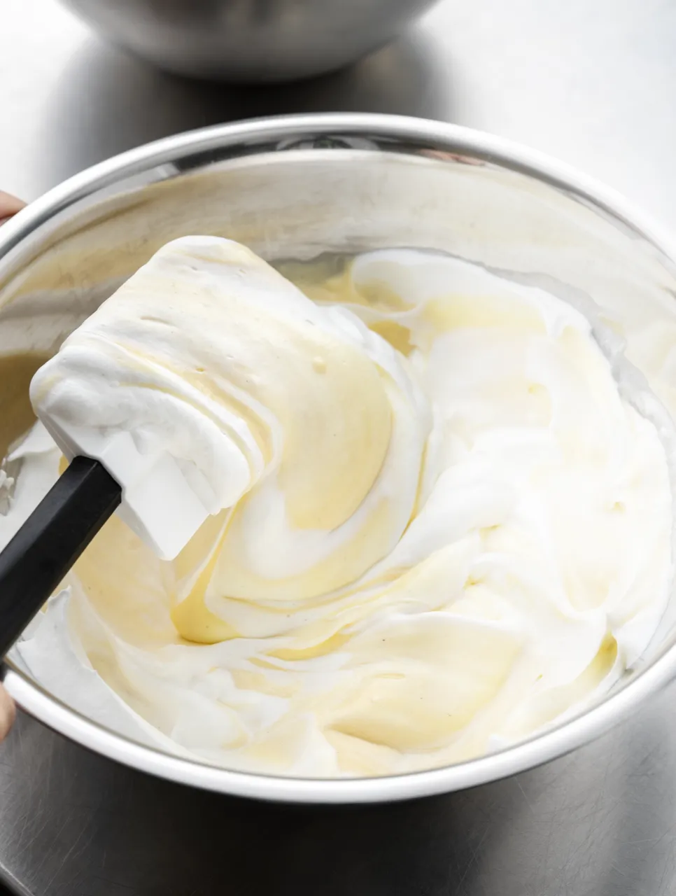 Whipped white filling with a spatula